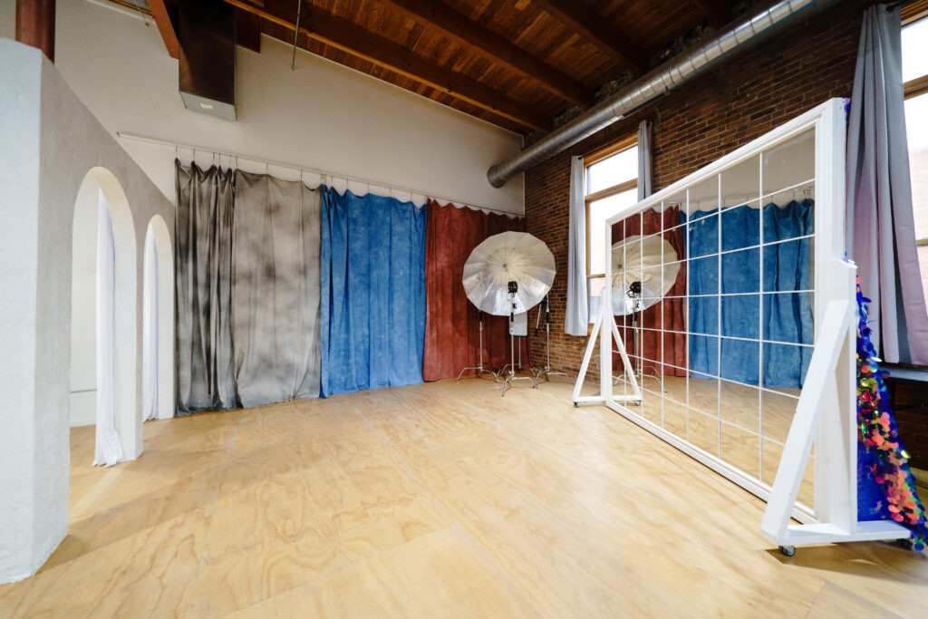 Daylight photo studio for rent in Chicago with corner windows, white arches near me Chicago 7