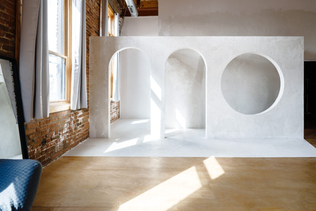 Daylight photo studio for rent in Chicago with corner windows, white arches near me Chicago 7