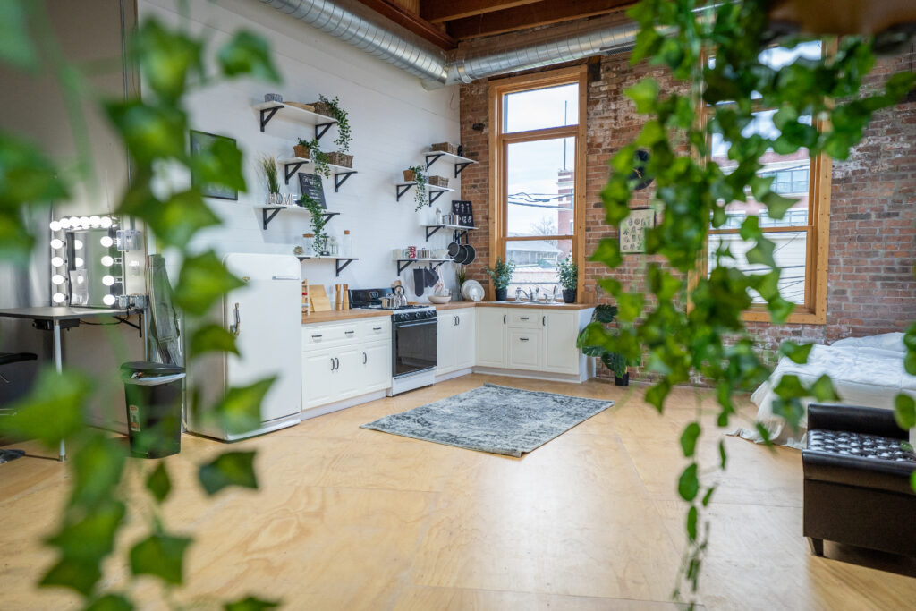 Chi 3 - cozy kitchen, brick corner, wood floor, mezzanine, large daylight photo studio