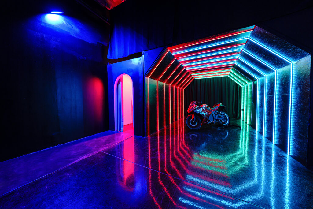 Large blackout studio with high ceilings, a Sport Bike, controllable sound synchronized RGB Lights, and RGB Tunnel for car photo and video shoots Chicago 1