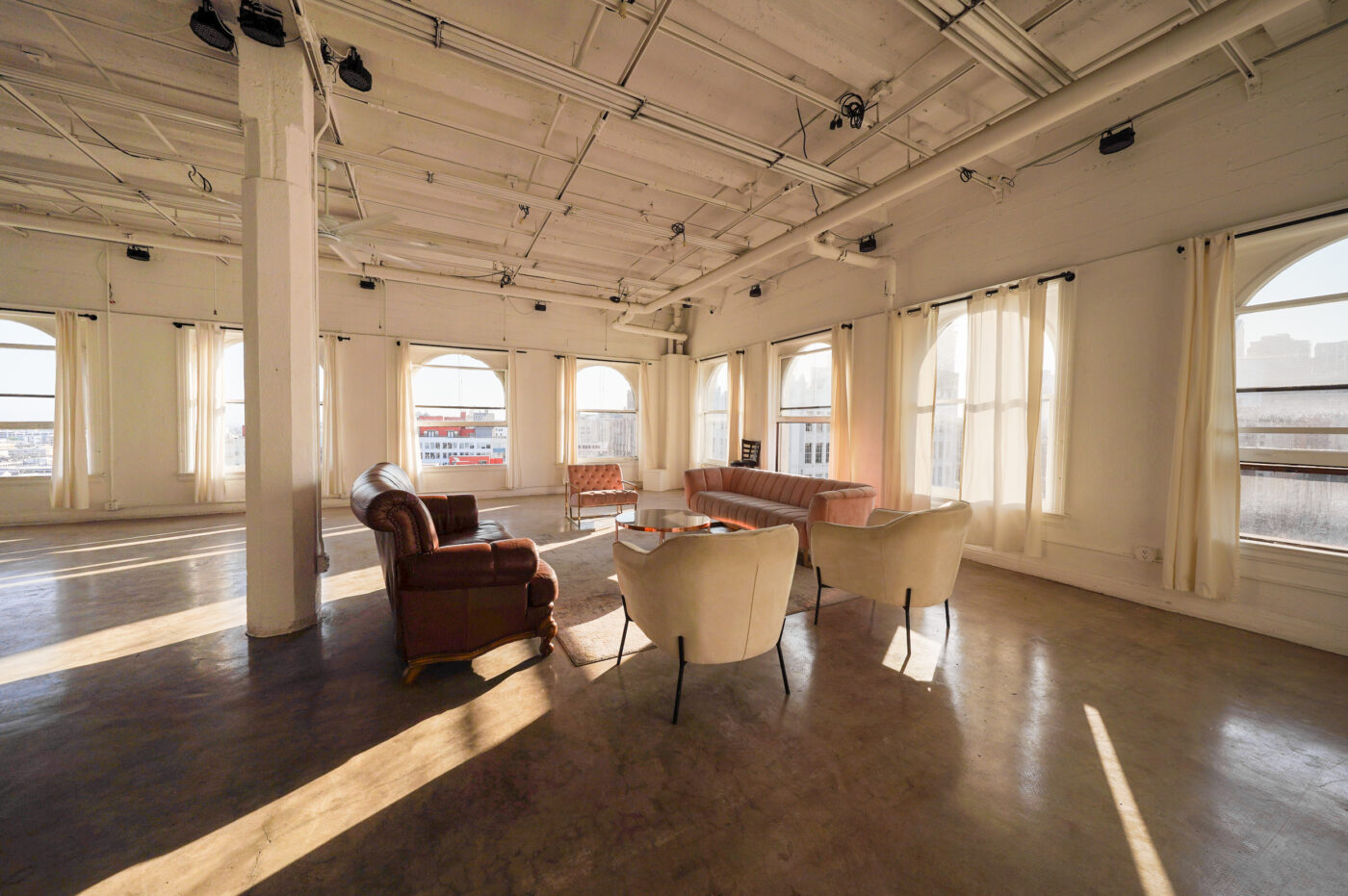 Daylight Photo studio for rent in Los angeles with arched windows and dt views