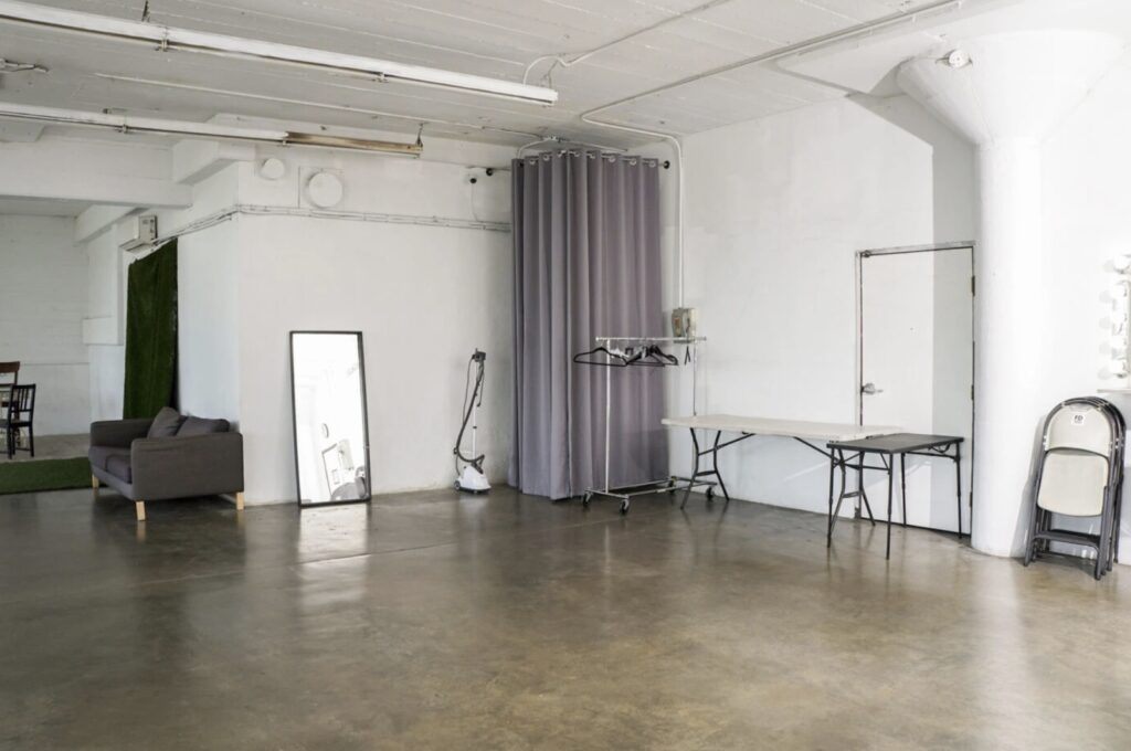 Example of amenities available at Studio C - makeup stations, mirrors, and organized space for your photoshoot needs.